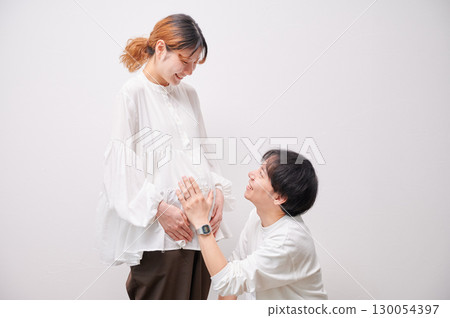 Couple facing each other, pregnant woman, maternity 130054397