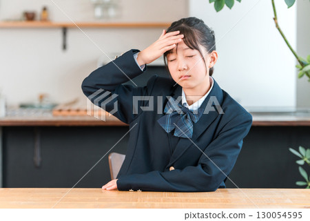 Worried at home, troubled, fever, cold, infection, headache, unwell junior high school students, high school students, elementary school students in uniform Worried at home, troubled, fever, cold, infection, headache, unwell junior high school students, high school students, elementary school students in uniform 130054595