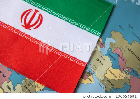 National flag of Iran on the world map background. 130054691