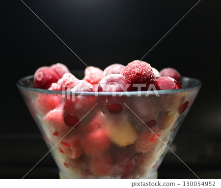 Bunch Of Whole Frozen Red Berries In A Misted Bowl On Black Background 130054952