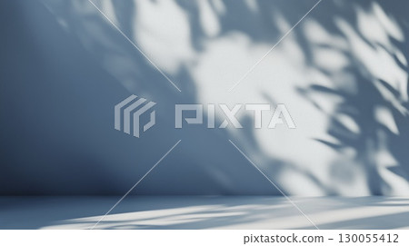 Soft sunlight and shadows on blue wall interior with clean minimal design, copy space 130055412