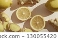 Lemon slices and fresh ginger roots, top view pattern, white background, copy space 130055420