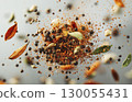 Macro shot of flying spices on black background with copy space, package design element 130055431