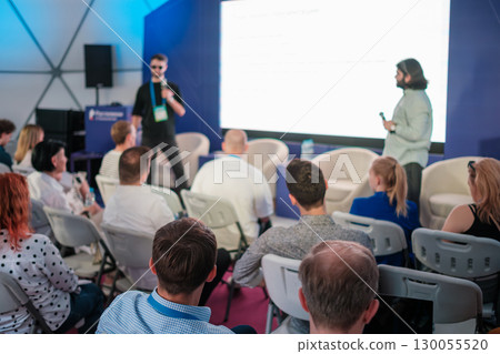 People attending a presentation at a professional seminar or business event meeting 130055520
