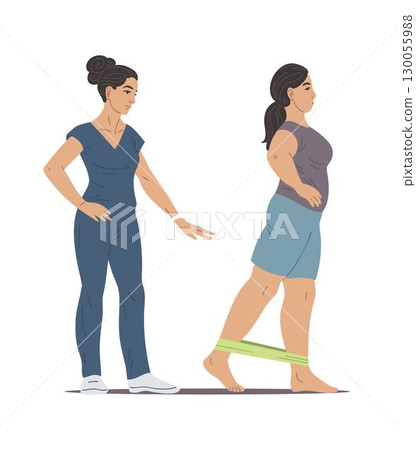 Woman physiotherapist helps female patient exercise with resistance band 130055988