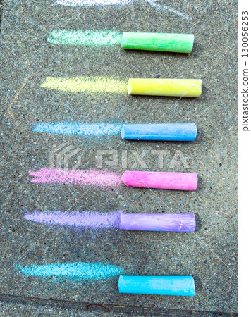 Colorful sidewalk chalks create a lively display on the pavement, perfect for outdoor art. Children love using them to express creativity and enjoy limitless artistic play and imagination 130056253