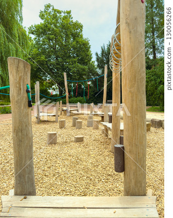 This natureinspired playground features wooden climbing structures and soft gravel, perfect for outdoor fun. Its designed for children to explore, engage in active play, and enjoy the fresh air This natureinspired playground features wooden climbing structures and soft gravel, perfect for outdoor fun. Its designed for children to explore, engage in active play, and enjoy the fresh air 130056266