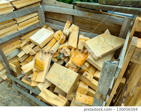Various Wooden Planks and plenty of Scrap Wood in a Storage Container are essential for crafting and construction projects, ensuring creativity and functionality in woodworking or DIY endeavors Various Wooden Planks and plenty of Scrap Wood in a Storage Container are essential for crafting and construction projects, ensuring creativity and functionality in woodworking or DIY endeavors 130056304