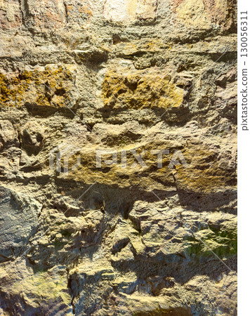 This beautiful natural stone wall texture features a variety of unique patterns and vibrant colors that are ideal for artistic projects as well as architectural designs or as a striking backdrop 130056311
