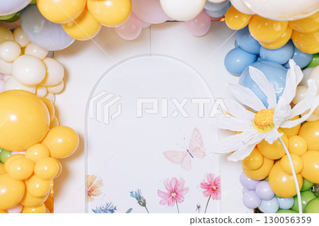 Colorful balloon decorations paired beautifully with floral accents create a joyful atmosphere, making them the perfect choice for festive celebrations and special occasions that radiate happiness 130056359