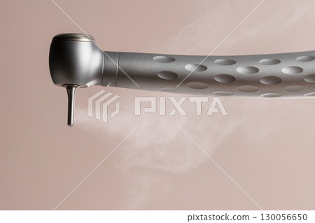 Close up of modern dental turbine handpiece with water spray on neutral background 130056650
