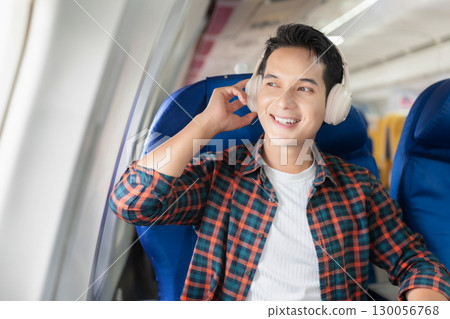 man, airplane, travel, enjoying comfortable flight while sitting in the airplane cabin. 130056768