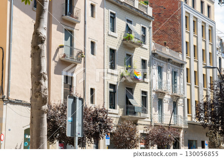 Flag with rainbow colors on a house with much beautiful balkone in Spain city.  130056855