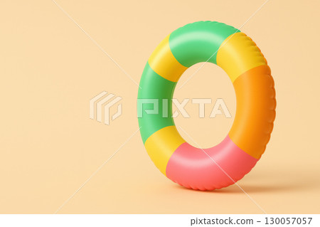 Inflatable pool float with tropical colors standing on minimal beige background, bright and playful summer accessory for water fun 130057057