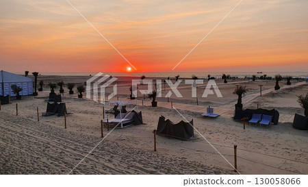 Panoramic beach landscape. Inspire tropical beach seascape horizon. Orange and golden sunset sky and relaxing sunlight summer mood. Vacation travel holiday banner. Panoramic beach landscape. Inspire tropical beach seascape horizon. Orange and golden sunset sky and relaxing sunlight summer mood. Vacation travel holiday banner. 130058066