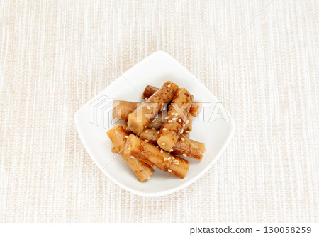 Shredded burdock root served in a small bowl 130058259