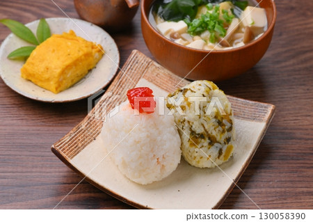 Rice ball (red roe and takana) set meal, miso soup and rolled egg. Rice ball (red roe and takana) set meal, miso soup and rolled egg. 130058390