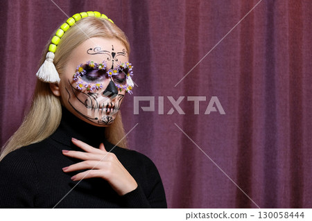 Halloween Make-Up Style, Fancy Dress and Diadem. Blond Model Wear Sugar Skull Makeup with Crown. Santa Muerte concept 130058444