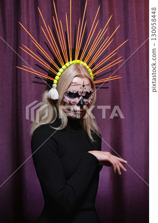 Halloween Make-Up Style, Fancy Dress and Diadem. Blond Model Wear Sugar Skull Makeup with Crown. Santa Muerte concept Halloween Make-Up Style, Fancy Dress and Diadem. Blond Model Wear Sugar Skull Makeup with Crown. Santa Muerte concept 130058448