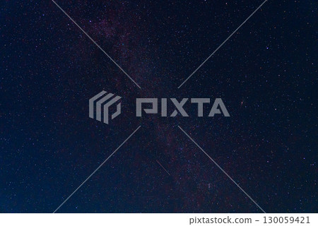 Photograph of the night sky with fragment of the Milky Way galaxy with falling meteorite and purple glow. Astronomy as science: study of celestial bodies, stars, meteors, asteroids and other objects Photograph of the night sky with fragment of the Milky Way galaxy with falling meteorite and purple glow. Astronomy as science: study of celestial bodies, stars, meteors, asteroids and other objects 130059421