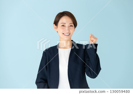 Female business portrait fist pump 130059480