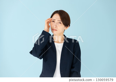 Female business portrait headache 130059579