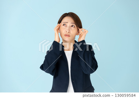 Female business portrait headache 130059584