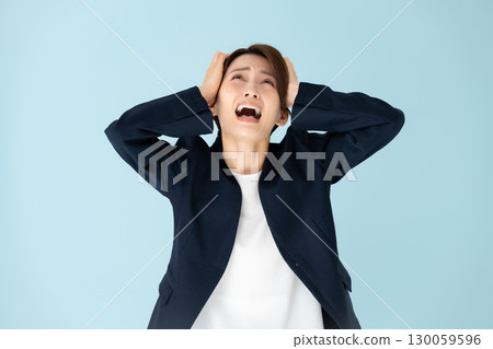 Woman business portrait holding head Woman business portrait holding head 130059596