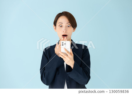 Woman business portrait smartphone surprised Woman business portrait smartphone surprised 130059836