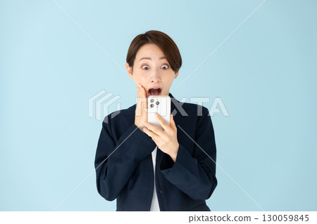 Woman business portrait smartphone surprised Woman business portrait smartphone surprised 130059845