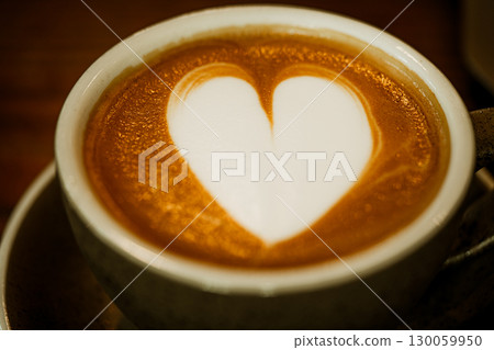 Cups of coffee decorated with a heart 130059950