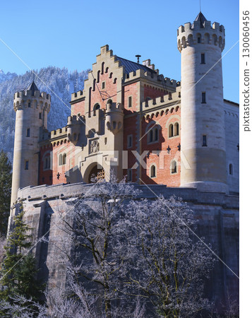 Historic castle stands majestically against a winter backdrop in Bavaria, showcasing stunning architecture and scenic beauty Historic castle stands majestically against a winter backdrop in Bavaria, showcasing stunning architecture and scenic beauty 130060456
