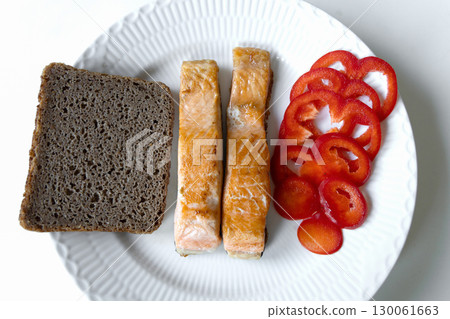 Freshly fried fish served with bread pepper 130061663