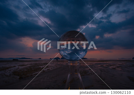 view of beach cloud at twilight inside crystal ball . view of beach cloud at twilight inside crystal ball . 130062110