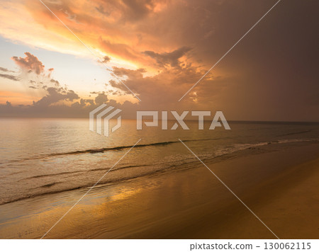 aerial view amazing cloud in colorful sky at sunset above the ocean. aerial view amazing cloud in colorful sky at sunset above the ocean. 130062115