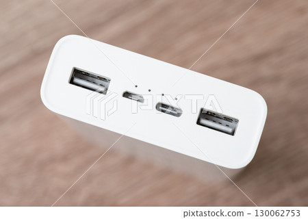 Close up of side powerbank with different usb ports. Two usb type-a, micro usb, usb type-c ports in powerbank Close up of side powerbank with different usb ports. Two usb type-a, micro usb, usb type-c ports in powerbank 130062753