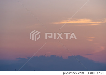 Sunset seen through the gaps in the clouds 130063739