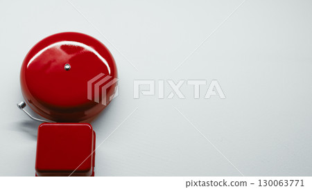 Red school bell on the wall with copy space  130063771