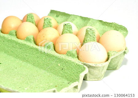 A tray with chicken eggs. 130064153