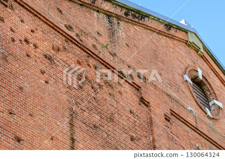 Machine gun fire marks from the Pacific War remain on the north side of the Handa Red Brick Building in Handa City. 130064324