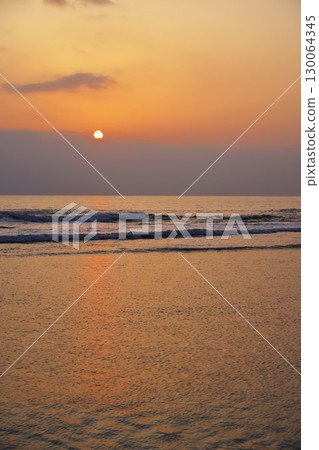 Cape Soya in early spring: The sun rises over the northernmost point of Japan in the morning glow of spring haze 130064345