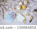 Autumn harvest of assorted pumpkins. Still life with pumpkins and autumn leaves on wooden surface. 130064858