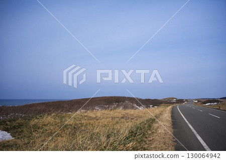 Sarobetsu, Hokkaido in early spring. The Ororon Line on the Sea of Japan shrouded in spring mist. 130064942