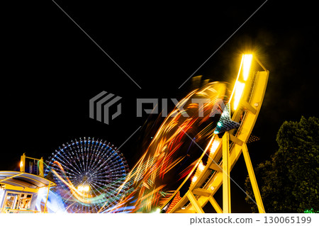Amusement park attractions at night Amusement park attractions at night 130065199