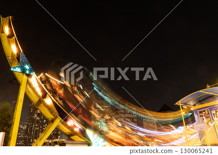 Amusement park attractions at night Amusement park attractions at night 130065241