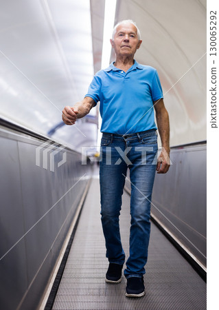 European old man going down to subway European old man going down to subway 130065292
