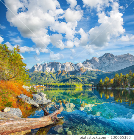 Amazing autumn landscape of Eibsee Lake in front of Zugspitze summit under sunlight. 130065393
