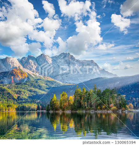 Amazing autumn landscape of Eibsee Lake in front of Zugspitze summit under sunlight. 130065394