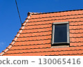 Roof of a house with window 130065416