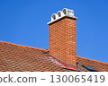 Roof of a building with smoke stack 130065419